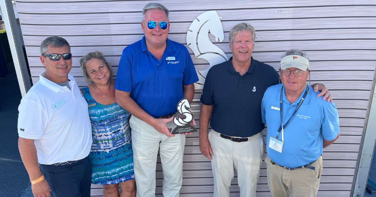Clarks Landing Yacht Sales accepting award at Miami Boat Show